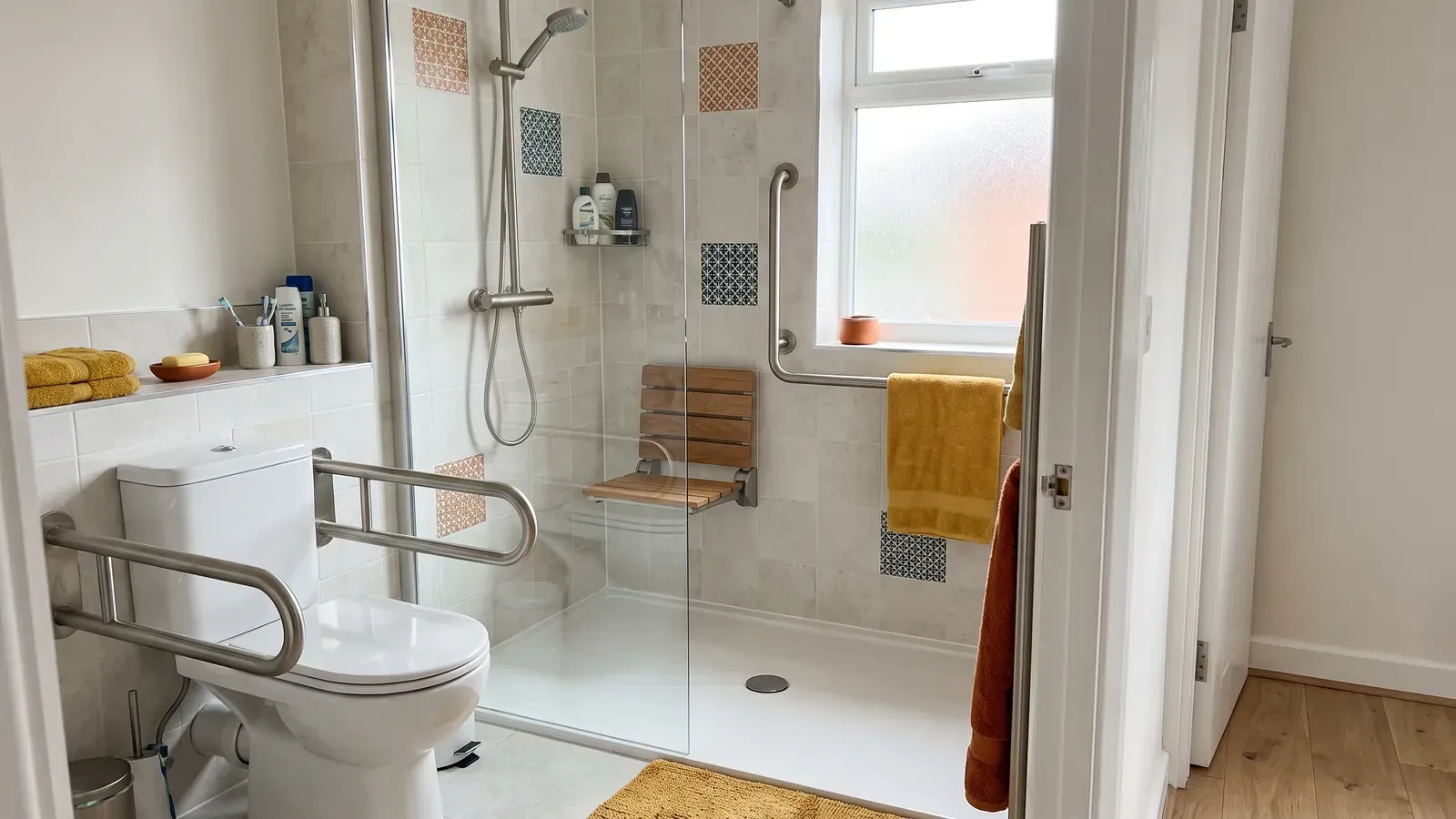 Bathroom adapted with a Disabled Facilities Grant: level-access shower, seat and grab rails